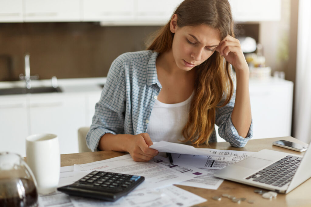 Woman Looking At Electricity Bills