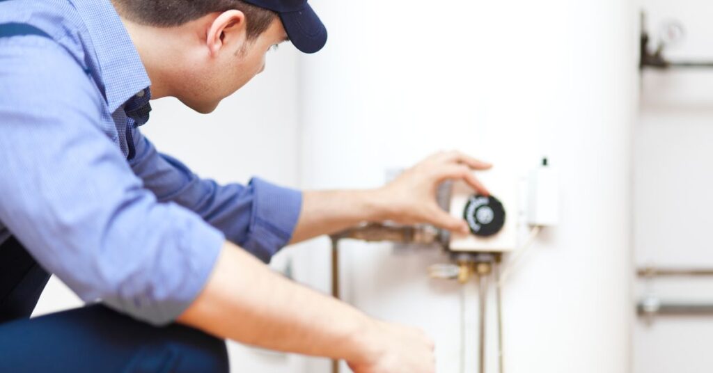 Man checking water heater