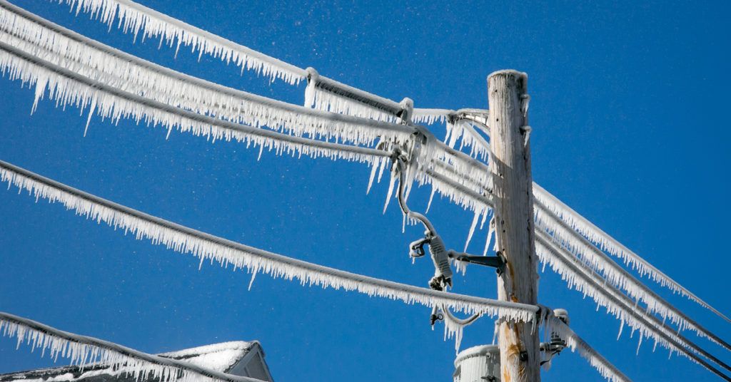 image of frozen electricity poles