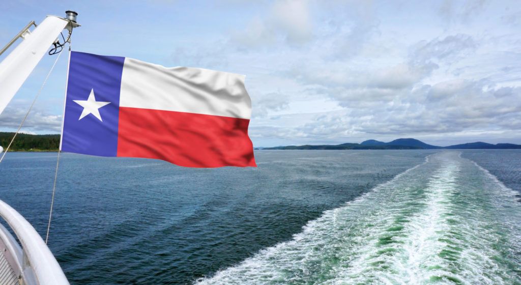 Texas flag flying on a boat during summer