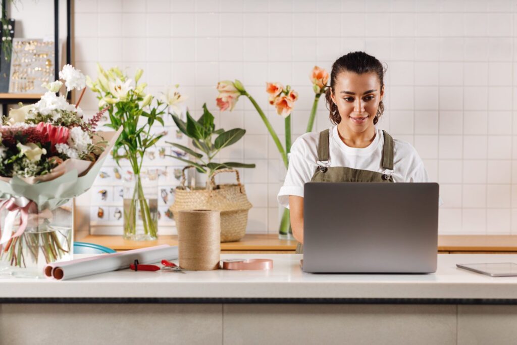 Florist shop owner on her computer