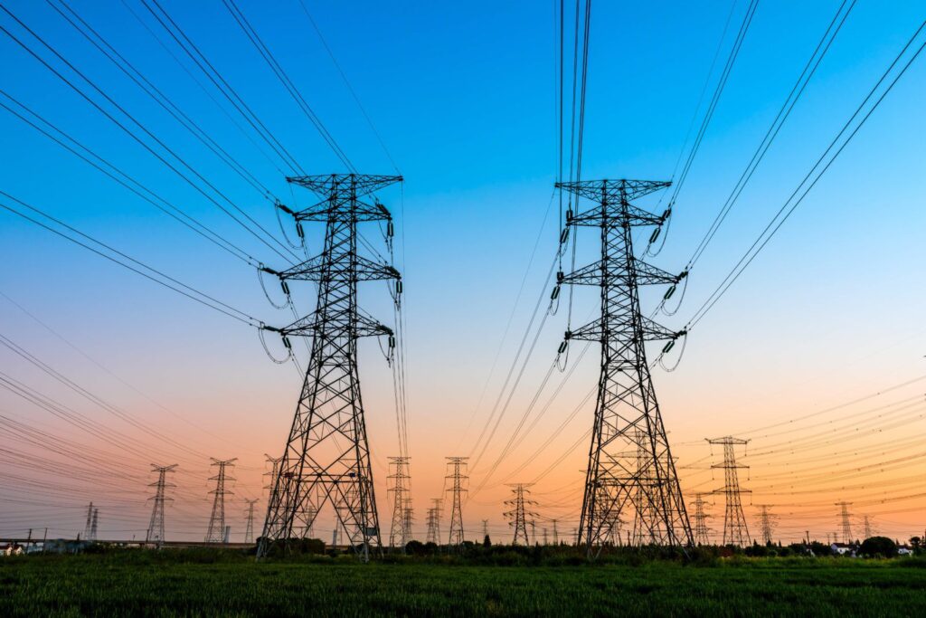 PA Standard Offer is expiring for over 70,000 residents in May. Photo of electricity transmission towers in the sunset.