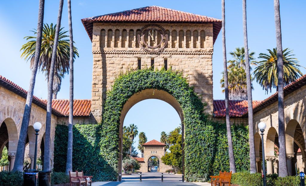 Entrance to the Main Quad at Stanford University; Ivy growing on decorative arches