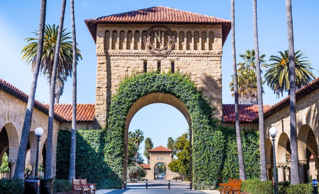 Entrance to the Main Quad at Stanford University; Ivy growing on decorative arches