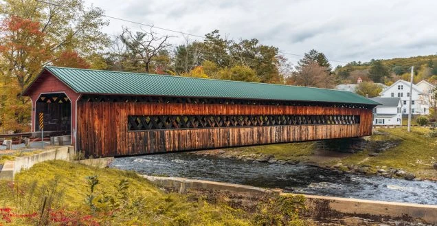 Eversource Energy rates are increasing beginning August 1, 2025. Photo of a covered bridge in Fall in Massachusetts.
