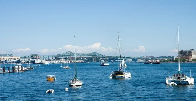Eversource Energy is increasing electricity rates August 1, 2026. Photo of harbor on St. Charles River in Boston, MA.